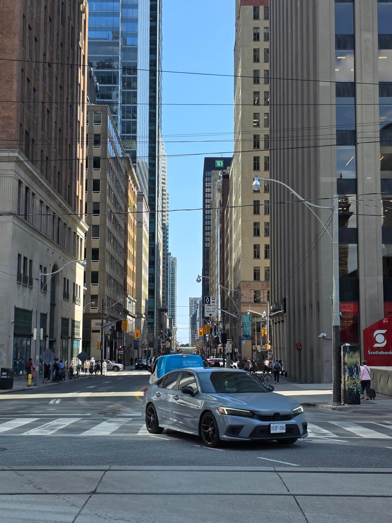 A shot down Queen Street West in downtown Toronto in the afternoon.